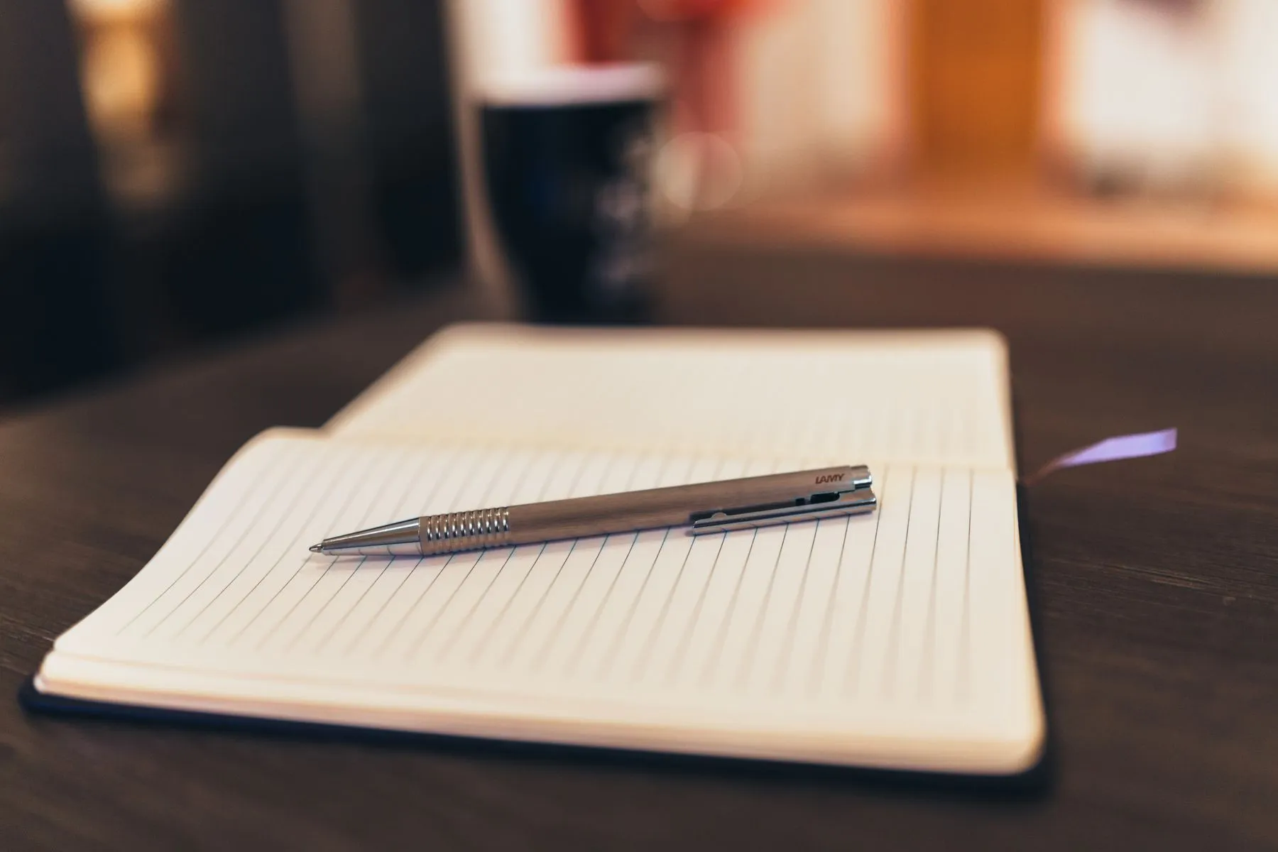 Paperwork and a pen on a kitchen table